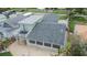 Rear exterior displaying a patio and lush landscaping at 1022 Canal St, Ruskin, FL 33570