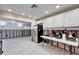 Bright kitchen area with white cabinetry, stainless steel appliances, and adjoining living space at 1022 Canal St, Ruskin, FL 33570