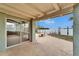 Inviting covered patio featuring sliding glass doors, perfect for enjoying waterfront views at 1022 Canal St, Ruskin, FL 33570