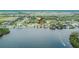Aerial waterfront view showing house's location with easy access to the water at 1022 Canal St, Ruskin, FL 33570
