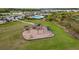 Community playground featuring swings, slides, and climbing structures, set in a well-maintained grassy area at 13038 Paddock Woods Pl, Riverview, FL 33579