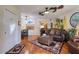 Cozy living room features wood floors, ceiling fans, and decor with a coastal theme, creating a relaxing atmosphere at 1488 Pine Glen Ln # B2, Tarpon Springs, FL 34688