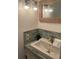 Stylish bathroom featuring modern fixtures, decorative lighting, and beautiful tiling, creating an elegant space at 14928 Capri Ln, Hudson, FL 34667