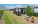 Spacious backyard featuring a screened patio and well-manicured lawn at 19367 Coastal Shore Ter, Land O Lakes, FL 34638