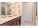 Bathroom featuring a double vanity and neutral color palette at 19367 Coastal Shore Ter, Land O Lakes, FL 34638