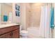 Bathroom featuring a shower and tub combination with a shower curtain at 19367 Coastal Shore Ter, Land O Lakes, FL 34638