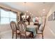 Comfortable dining room with traditional furniture and ample natural light, connected to the kitchen at 19367 Coastal Shore Ter, Land O Lakes, FL 34638