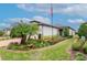 Landscaped front of home with a well-manicured lawn and inviting curb appeal at 19367 Coastal Shore Ter, Land O Lakes, FL 34638