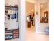 Hallway view of the kitchen with stainless steel appliances and dark wood cabinetry at 19367 Coastal Shore Ter, Land O Lakes, FL 34638