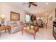 Comfortable living room flows into the dining area and kitchen, perfect for entertaining guests at 19367 Coastal Shore Ter, Land O Lakes, FL 34638
