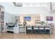 Modern lounge area with stylish seating, a serving area, and contemporary design at 19367 Coastal Shore Ter, Land O Lakes, FL 34638