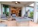 Enclosed patio with comfortable seating and a view to the living areas at 19367 Coastal Shore Ter, Land O Lakes, FL 34638