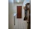 Functional laundry area features tile floors, with a door and cleaning supplies rack on the wall at 2913 Aston Ave, Plant City, FL 33566