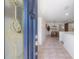 Inviting foyer featuring tile flooring, a decorative front door, and a view into the dining area at 3611 W De Leon St, Tampa, FL 33609