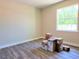 An empty bedroom is ready for occupancy and features wood look floors at 422 Shannon Estates Ct, Plant City, FL 33563
