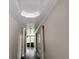 Bright hallway showcases crown molding, archways, and luxury vinyl plank flooring at 422 Shannon Estates Ct, Plant City, FL 33563