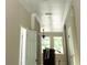 Hallway featuring archways, crown molding, and doors leading to other areas of the house at 422 Shannon Estates Ct, Plant City, FL 33563