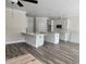 Open-concept kitchen featuring white cabinets, bar seating, and modern appliances at 422 Shannon Estates Ct, Plant City, FL 33563