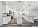 Bright kitchen features white cabinets, stainless steel appliances, granite countertops, and modern pendant lighting at 422 Shannon Estates Ct, Plant City, FL 33563