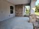 Covered entryway featuring brick accents and a window, perfect for enjoying the outdoors at 422 Shannon Estates Ct, Plant City, FL 33563