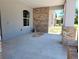 Spacious covered entry featuring stylish brick and columns, offering a welcoming entrance at 422 Shannon Estates Ct, Plant City, FL 33563