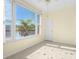 Bright bedroom boasts a large window with waterfront view and ample natural light and tile flooring at 5940 30Th S Ave # 209, Gulfport, FL 33707