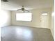Bright living room featuring tile flooring, a ceiling fan, and a window for plenty of natural light at 5940 30Th S Ave # 209, Gulfport, FL 33707