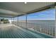 Expansive balcony providing an unobstructed panoramic view of the ocean at 6423 Driftwood Dr, Hudson, FL 34667