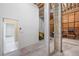 Unfinished basement area with block walls, exposed ceiling, and a yellow lawn mower at 6423 Driftwood Dr, Hudson, FL 34667