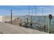 Private boat dock equipped with a boat lift and bench seating offers a tranquil waterfront experience at 6423 Driftwood Dr, Hudson, FL 34667