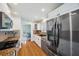 Modern kitchen with stainless steel appliances, granite countertops, and hardwood floors at 6423 Driftwood Dr, Hudson, FL 34667