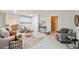 Cozy living room features tile floors and neutral furnishings with pops of orange at 6423 Driftwood Dr, Hudson, FL 34667