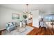 Cozy sitting room featuring an ocean view, hardwood floors, and elegant decor at 6423 Driftwood Dr, Hudson, FL 34667