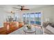 A sunlit living room with hardwood floors, complemented by ocean view, and neutral decor at 6423 Driftwood Dr, Hudson, FL 34667