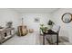Home office featuring neutral decor, tile floors, and a modern black desk at 6423 Driftwood Dr, Hudson, FL 34667