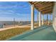 Enjoy waterfront views from the covered patio with direct access to a private dock and serene water at 6423 Driftwood Dr, Hudson, FL 34667