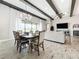 Elegant dining room with a chandelier, large windows, and views of the backyard at 13028 Homestead Ln, Parrish, FL 34219