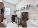 Organized laundry room equipped with a washer, sink, and ample storage space at 13028 Homestead Ln, Parrish, FL 34219