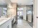 The main bath is equipped with double vanities, a separate shower, and access to the main bedroom at 13028 Homestead Ln, Parrish, FL 34219