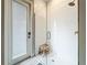 Modern shower with white tile, glass door, and bronze fixtures at 13028 Homestead Ln, Parrish, FL 34219