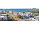 An eye-level aerial view showing a clear shot of the condo buildings and bay at 131 Bluff View Dr # 103, Belleair Bluffs, FL 33770