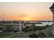 Tranquil sunset view overlooking the waterfront and neighborhood, featuring a vibrant orange sky at 131 Bluff View Dr # 103, Belleair Bluffs, FL 33770