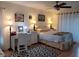 Bright bedroom includes a ceiling fan, ample lighting and a decorative rug and furniture at 255 Capri N Cir # 17, Treasure Island, FL 33706