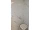 White marble-look tiled shower with a built-in seat and a small window at 255 Capri N Cir # 17, Treasure Island, FL 33706
