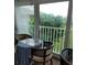 Inviting sunroom features a cozy dining area with natural light and beautiful outdoor views at 255 Capri N Cir # 17, Treasure Island, FL 33706