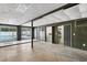 Basement features sliding doors to the pool, laundry area and paneled walls at 4902 Stolls Ave, Tampa, FL 33615