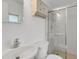 Clean bathroom featuring a glass-enclosed shower and vanity storage at 4902 Stolls Ave, Tampa, FL 33615