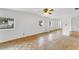 Bedroom features hardwood floors, and bright natural light at 4902 Stolls Ave, Tampa, FL 33615