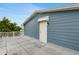 Exterior of home shows rooftop deck and access door at 4902 Stolls Ave, Tampa, FL 33615