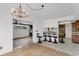 Eat-in kitchen features tile flooring, pendant lighting, and bar seating at 4902 Stolls Ave, Tampa, FL 33615
